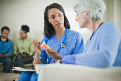 A doctor discusses hepatitis C treatment with a patient.